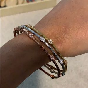 White, yellow and rose gold bangle set with stones